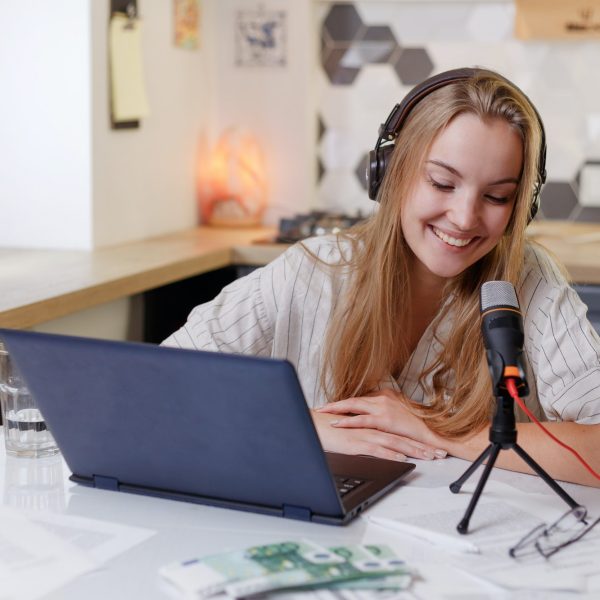 blonde-woman-wearing-headphones-with-microphone-learning-online-training-class.jpg